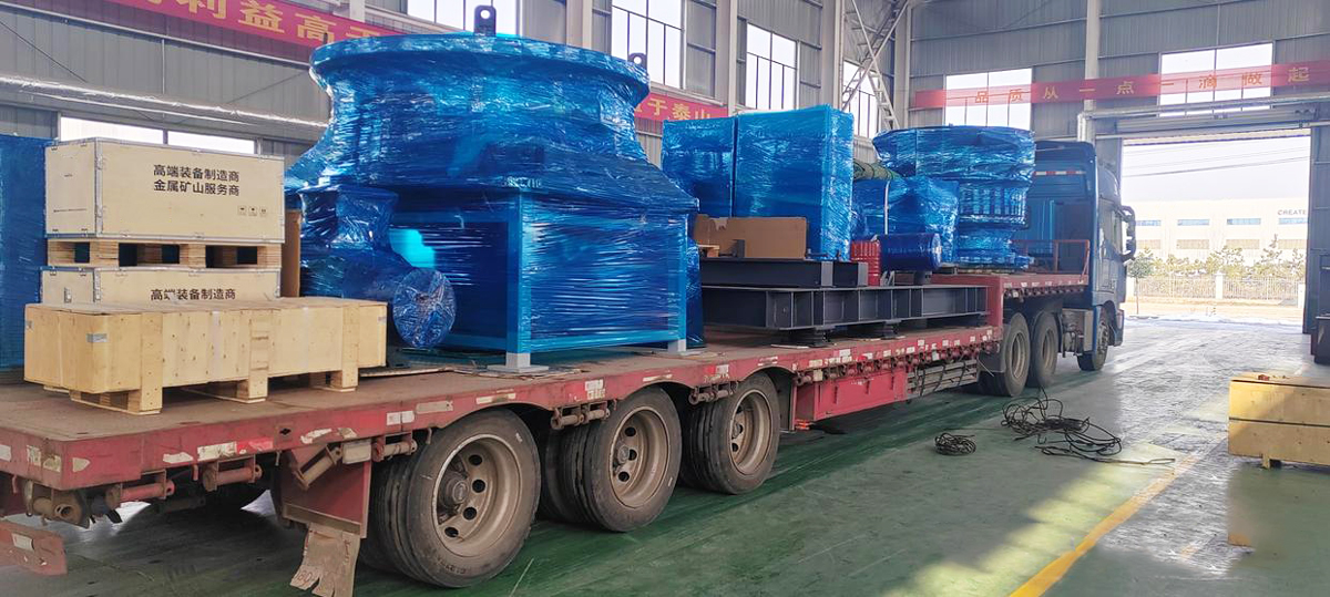 Yonsmen heavy mining equipment crusher parts loading onto flatbed truck for site delivery
