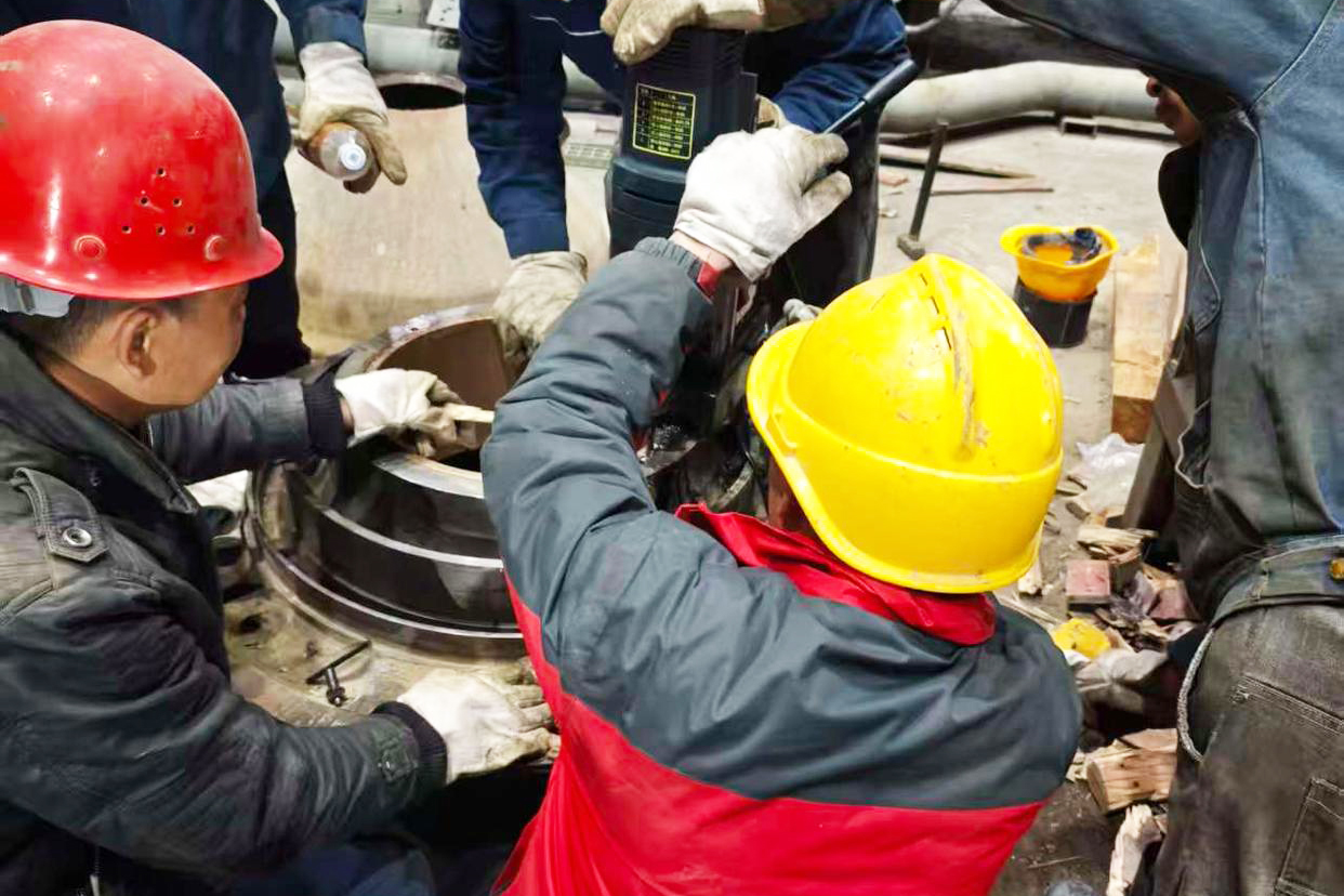 cone crusher parts emergency repair on site with engineers disassembling eccentric assembly