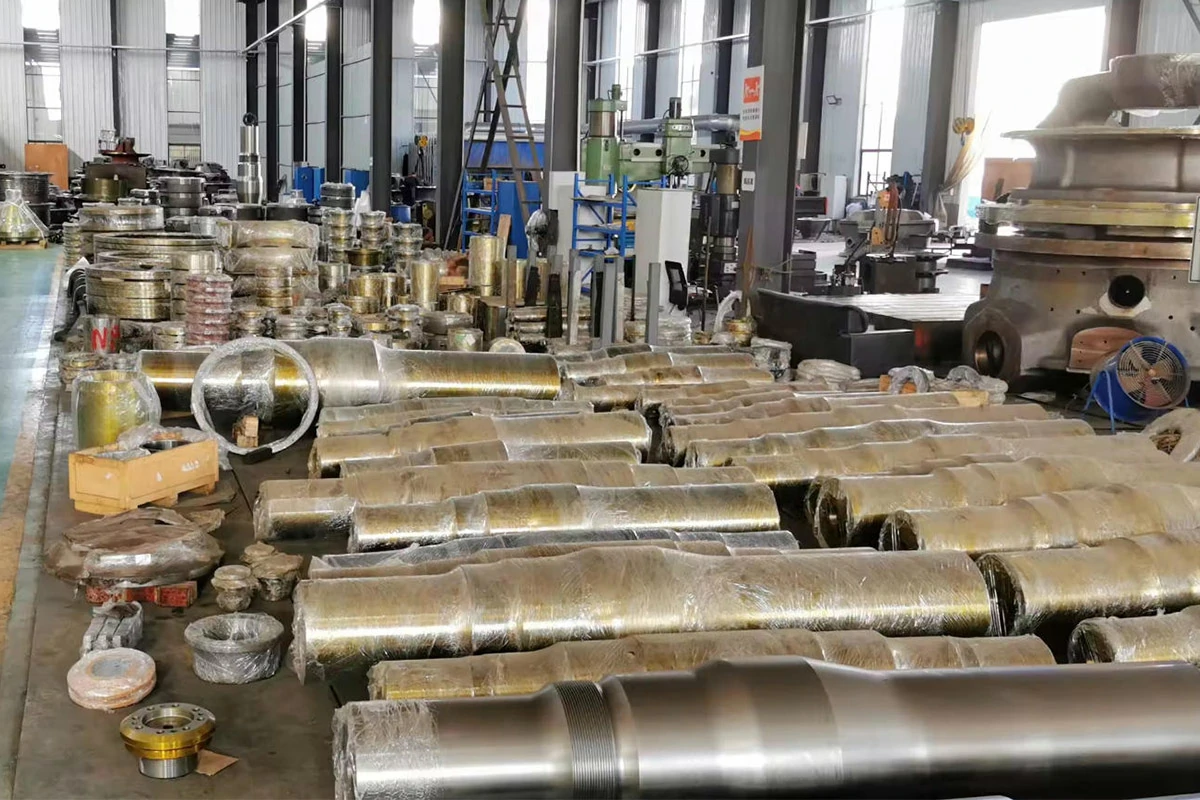 Heavy crusher main shafts stored in a controlled factory warehouse