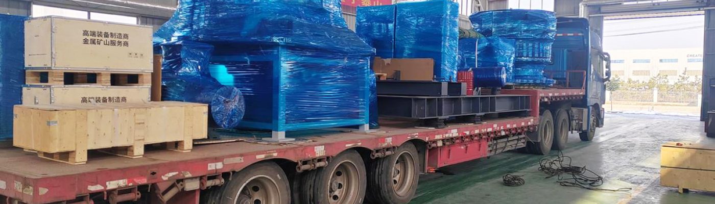 Yonsmen heavy mining equipment crusher parts loading onto flatbed truck for site delivery